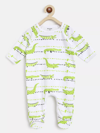 Baby onesie with green dinosaur pattern on a white background