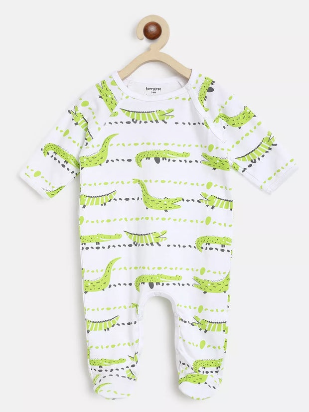 Baby onesie with green dinosaur pattern on a white background