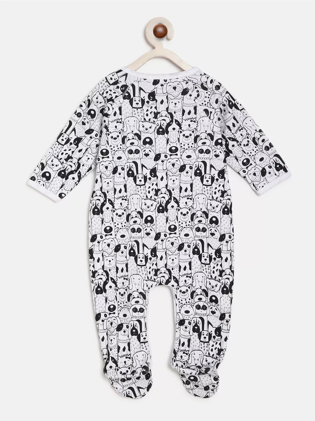 Black and white patterned baby onesie on a hanger against a white background