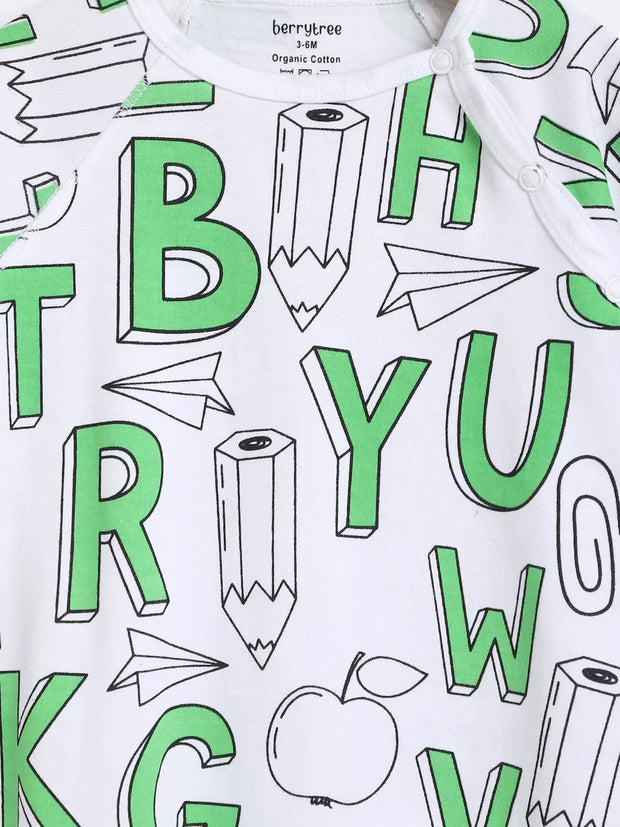 White fabric with green letters and school-themed designs on a white background