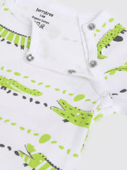 Baby romper with green and black crocodile pattern on a white background