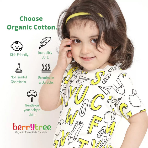 Child wearing a white shirt with yellow letters, surrounded by text about organic cotton and the brand 'berrytree'.