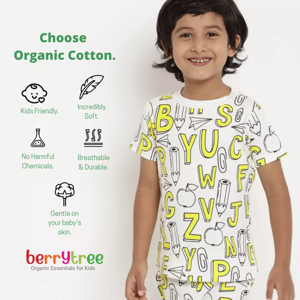 Child wearing a white t-shirt with yellow letter patterns, standing against a white background with 'berrytree' branding.