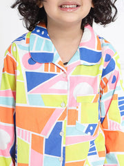Child wearing a colorful geometric patterned shirt on a white background