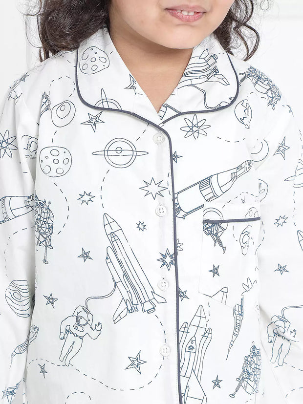 Children's pajama top with space-themed print on a white background